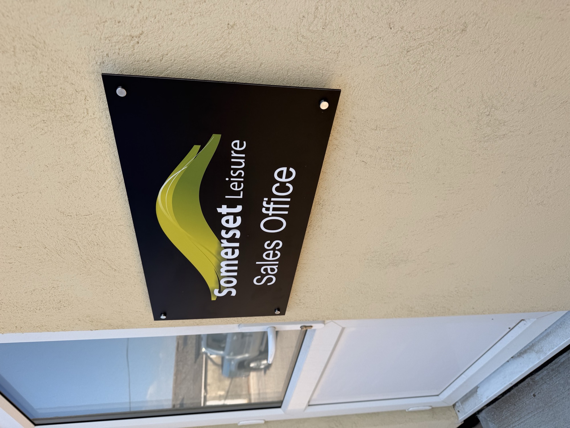 Somerset Leisure Sales Office rigid site board mounted on an exterior wall