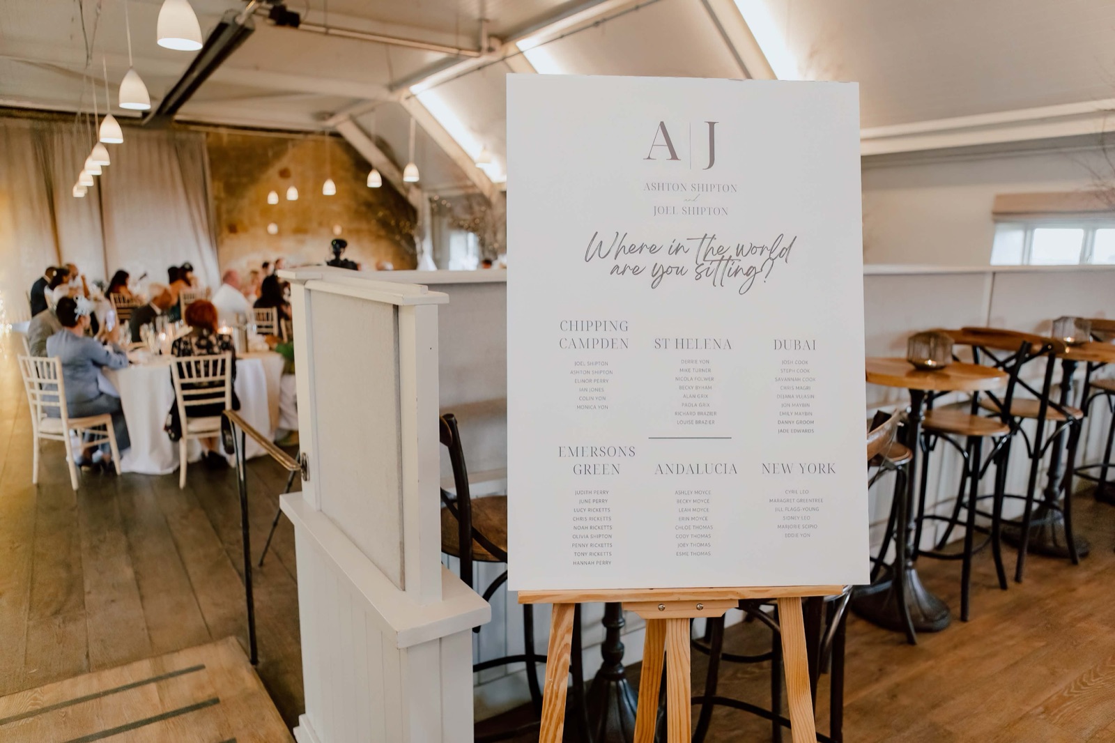 A1 wedding table plan board on an easel at a reception venue
